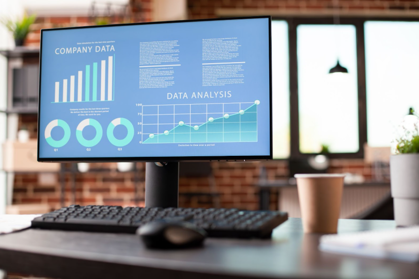 Laptop on desk showing chart of AI marketing revenue